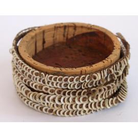 String and shell arm band with cork support