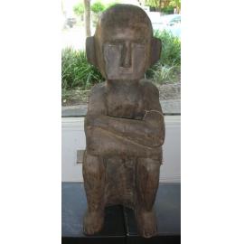 Male Wooden carving in sitting position