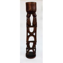 Carved wooden decorative stand with bowl on top for offerings